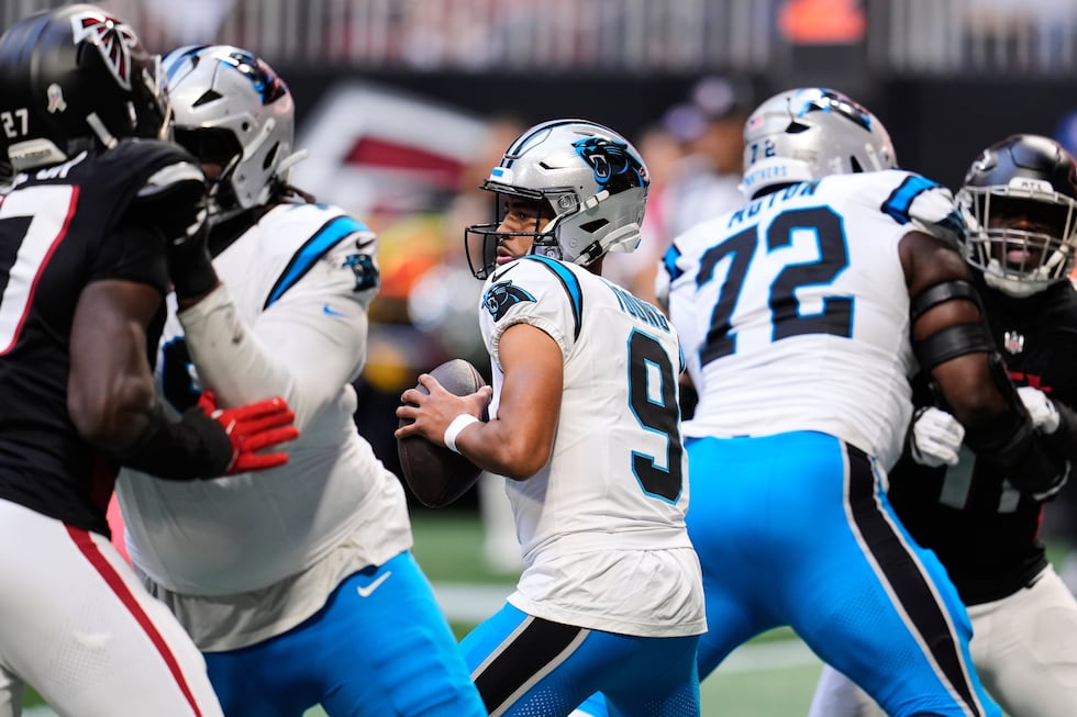 Carolina Panthers quarterback Bryce Young (9) drops back under pressure in the first half of...