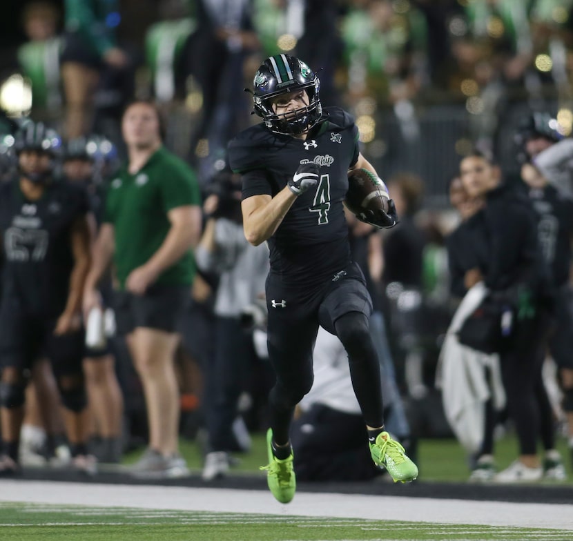 Prosper receiver Dallas Boozer (4) runs along the Eagles sideline for a long receiving...