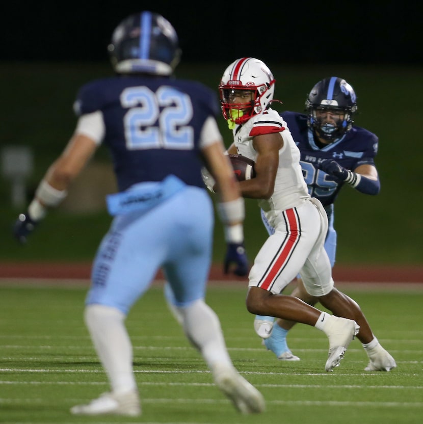 Rockwall Heath receiver Shawn Gary (7) looks to tack on extra yardage after a first quarter...