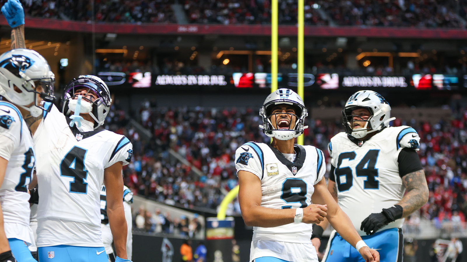 Carolina Panthers quarterback Bryce Young (9) reacts to a touchdown in the fourth quarter against the Atlanta Falcons at Mercedes-Benz Stadium.