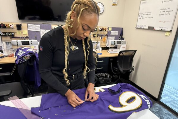 Ebony Short alters a Baltimore Ravens uniform