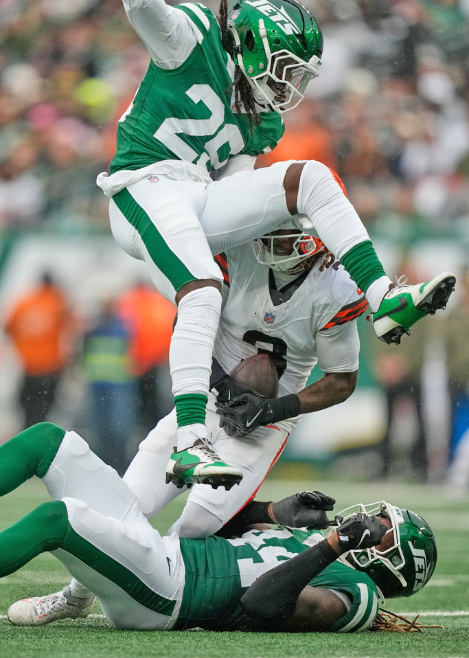 Cleveland Browns wide receiver Jerry Jeudy (3) is brought down by New York Jets linebacker Jamien Sherwood (44) and cornerback Jarvis Brownlee Jr. (29) in the first half of an NFL football game, Sunday, Nov. 9, 2025, in East Rutherford, N.J.