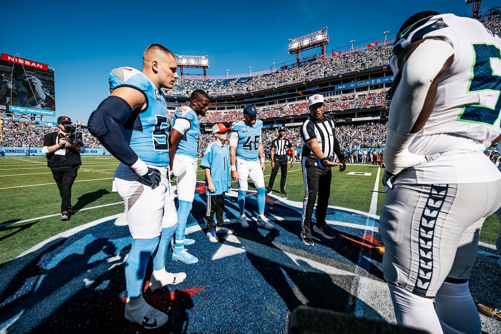 Linebacker Cody Barton #50 of the Tennessee Titans, Wide receiver Van Jefferson #11 of the...