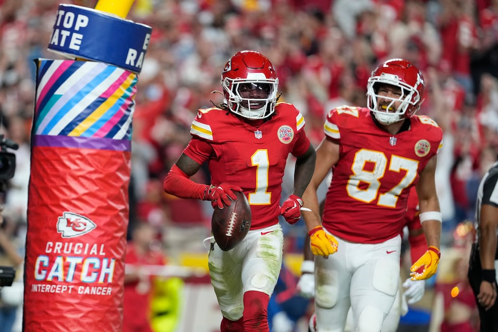 Kansas City Chiefs wide receiver Xavier Worthy (1) celebrates after scoring as teammate Travis...
