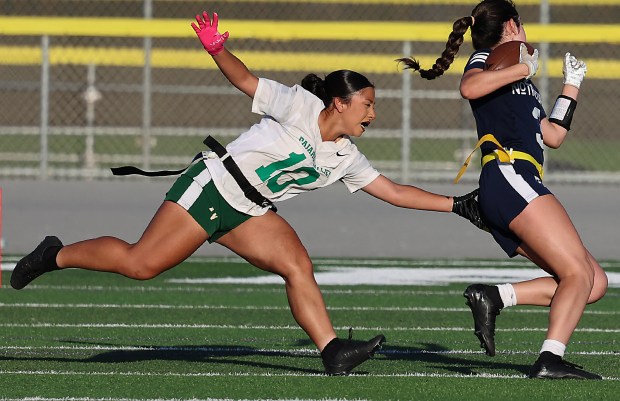 Pajaro Valley High’s Perla Rivera grabs a flag to stop...
