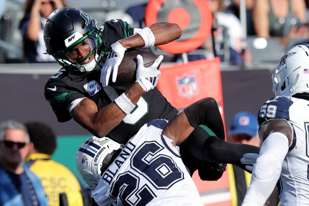 New York Jets wide receiver Garrett Wilson (5) in action against Dallas Cowboys cornerback Daron Bland (26) during an NFL football game on Sunday, Oct. 5, 2025, in East Rutherford, N.J. (Brad Penner/AP Images for Panini)