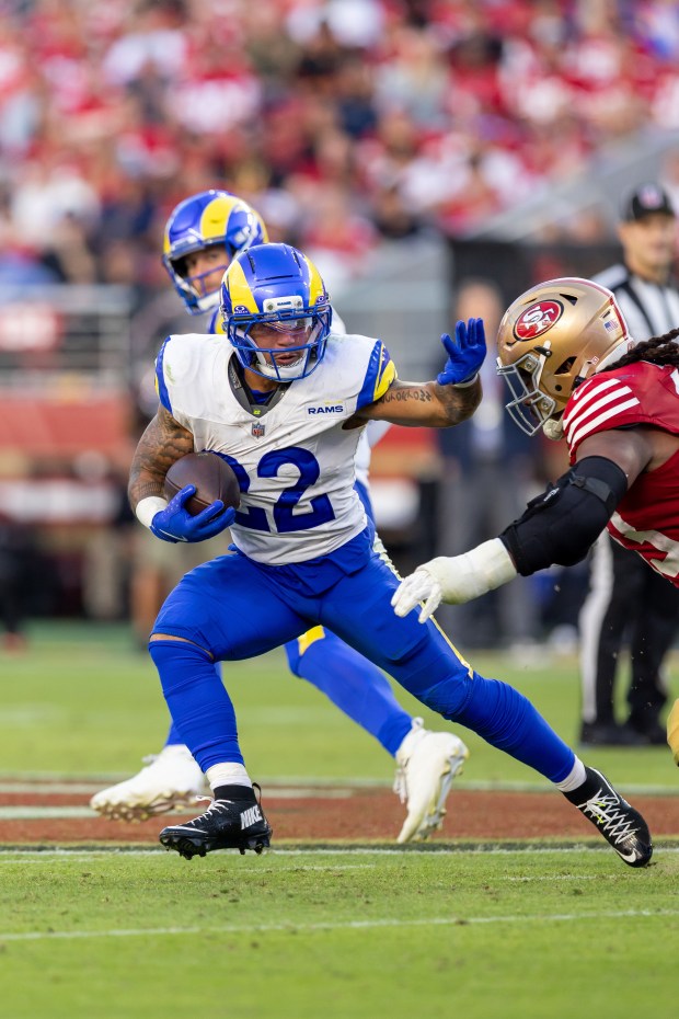 Los Angeles Rams running back Blake Corum (22) runs the ball against the San Francisco 49ers in an NFL football game, Sunday, Nov. 9, 2025, in Santa Clara, Calif. (AP Photo/Jeff Lewis)