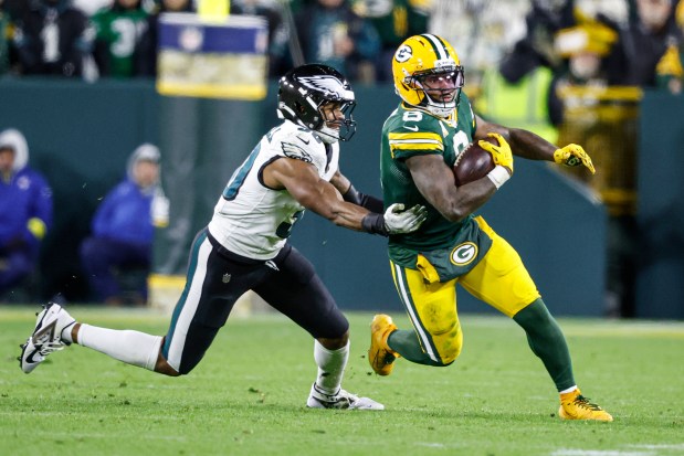 Green Bay Packers running back Josh Jacobs (8) runs with the ball during an NFL game against the Philadelphia Eagles,, Monday, Nov. 10, 2025, in Green Bay, Wis. (AP Photo/Jeffrey Phelps