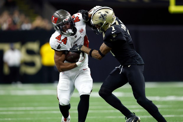 Tampa Bay Buccaneers running back Sean Tucker (44) runs the ball during an NFL football game against the New Orleans Saints, Sunday, Oct. 26, 2025, in New Orleans. (AP Photo/Tyler Kaufman)