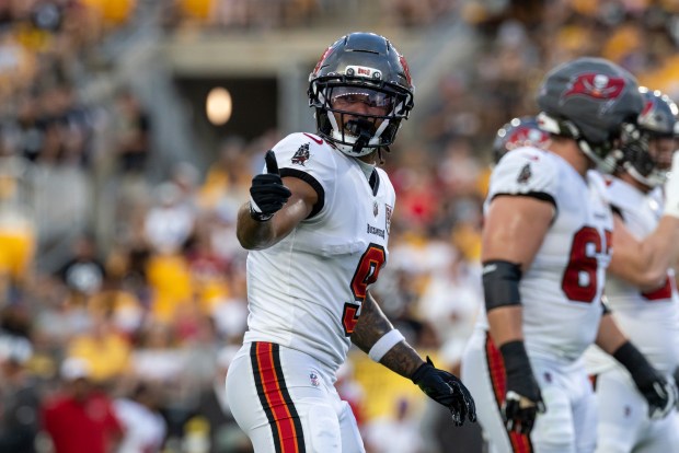 Tampa Bay Buccaneers wide receiver Emeka Egbuka (9) signals during a pre-season NFL football game, Saturday, Aug. 16, 2025, in Pittsburgh. (AP Photo/Matt Durisko)