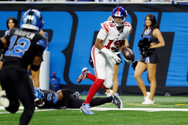 New York Giants quarterback Jameis Winston (19) runs the ball for a touchdown after he makes a reception against the Detroit Lions during an NFL football game in Detroit, Sunday, Nov. 23, 2025. (AP Photo/Rick Osentoski)