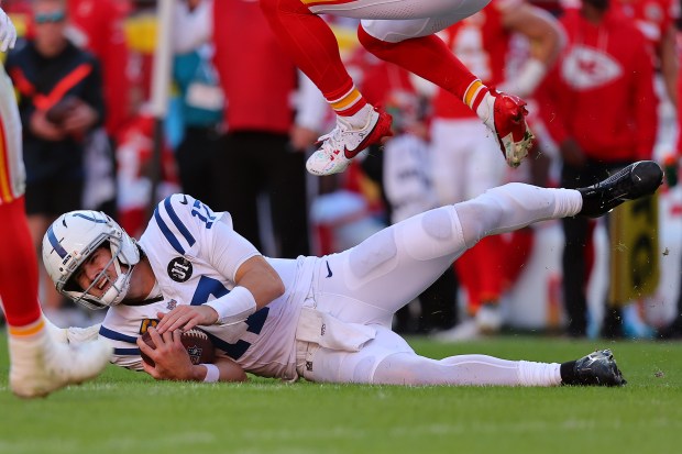 KANSAS CITY, MISSOURI - NOVEMBER 23: Daniel Jones #17 of the Indianapolis Colts slides after a scramble in the third quarter of the game against the Kansas City Chiefs at Arrowhead Stadium on November 23, 2025 in Kansas City, Missouri. (Photo by David Eulitt/Getty Images)