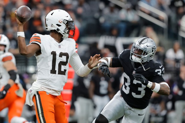 LAS VEGAS, NEVADA - NOVEMBER 23: Shedeur Sanders #12 of the Cleveland Browns makes a pass in the game against Jamal Adams #33 of the Las Vegas Raiders at Allegiant Stadium on November 23, 2025 in Las Vegas, Nevada. (Photo by Steve Marcus/Getty Images)