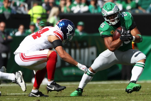 Philadelphia Eagles running back Saquon Barkley (26) runs with the ball during an NFL football game against the New York Giants, Sunday, Oct. 26, 2025 in Philadelphia. (AP Photo/Daniel Kucin Jr.)