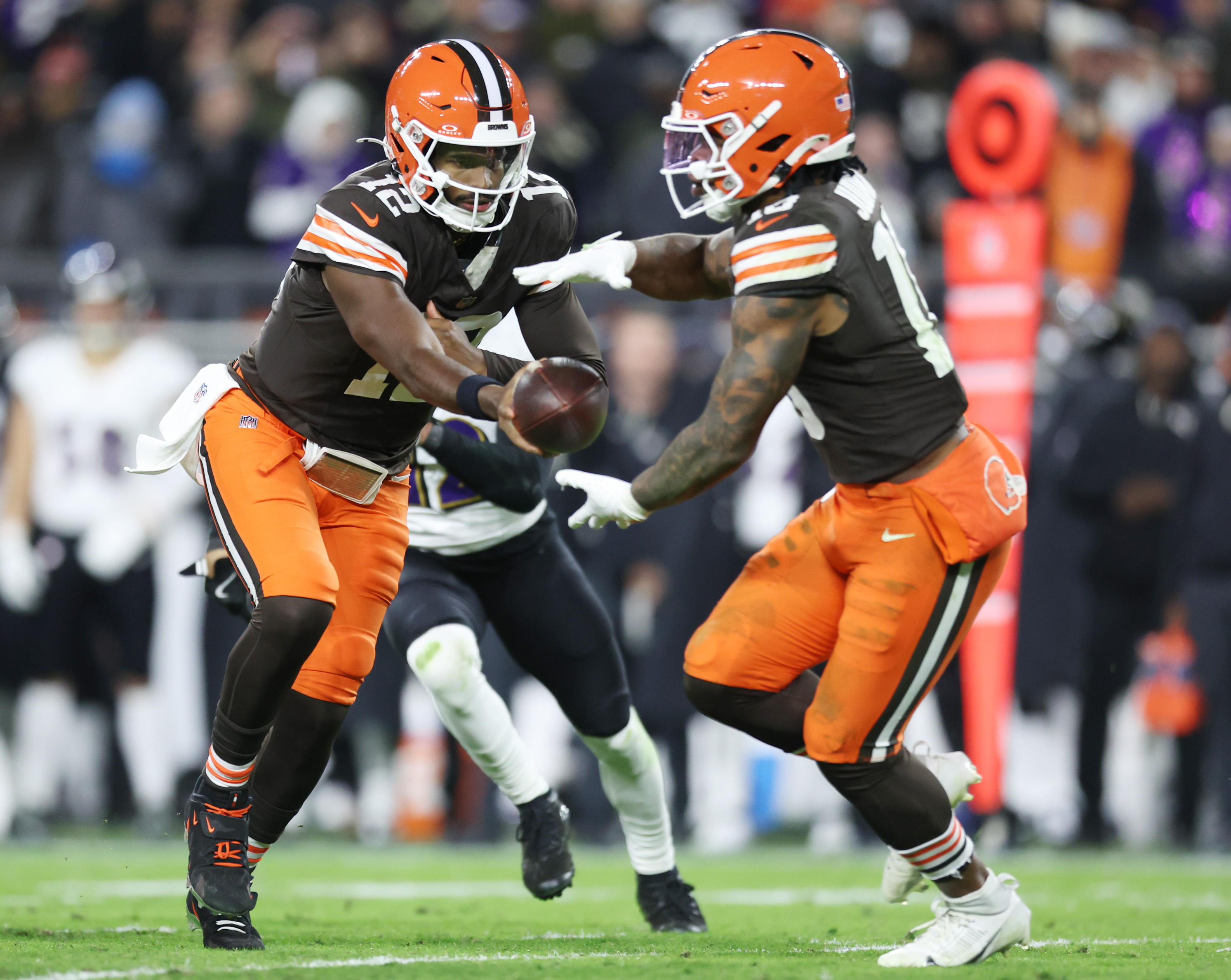 Cleveland Browns quarterback Shedeur Sanders hands the football off to Cleveland Browns running back Quinshon Judkins in the third quarter against the Baltimore Ravens.