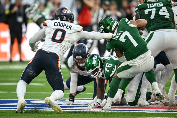 Jonathon Cooper (0) of the Denver Broncos seals the game as he sacks Justin Fields (7) of the New York Jets during the fourth quarter of the Broncos' 13-11 win at Tottenham Hotspur Stadium in London on Sunday, Oct. 12, 2025. (Photo by AAron Ontiveroz/The Denver Post)