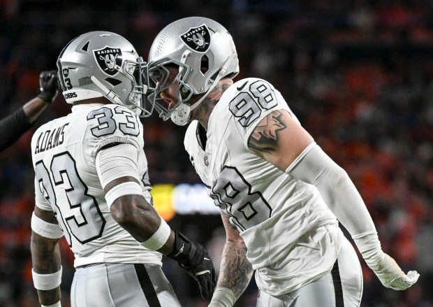 Maxx Crosby (98) of the Las Vegas Raiders celebrates making...