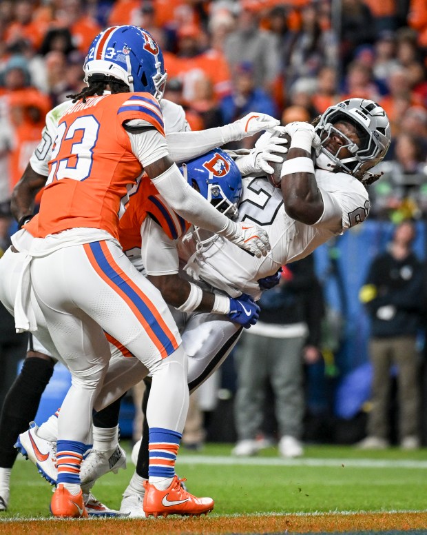 Ashton Jeanty (2) of the Las Vegas Raiders scores a...