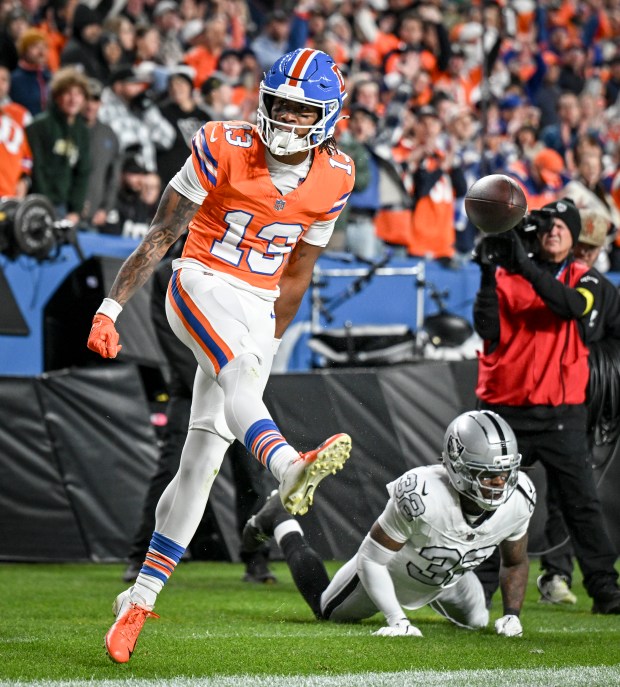 Pat Bryant (13) of the Denver Broncos dances after making...