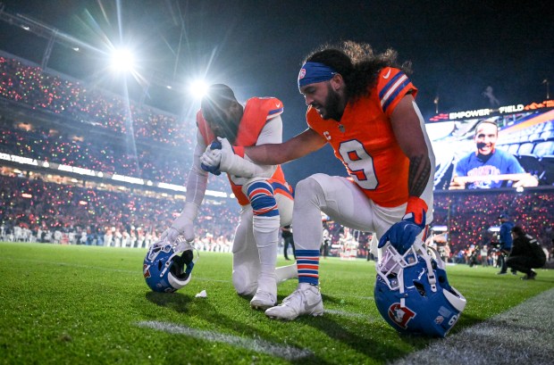 Jonathon Cooper (0) and Talanoa Hufanga (9) of the Denver...