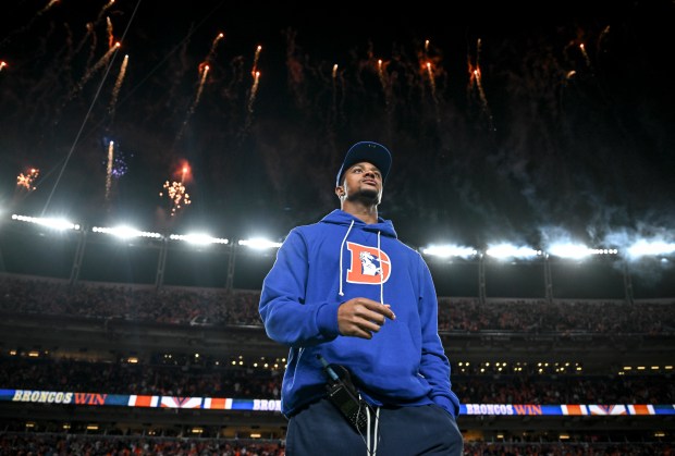 Pat Surtain II (2) of the Denver Broncos walks the...