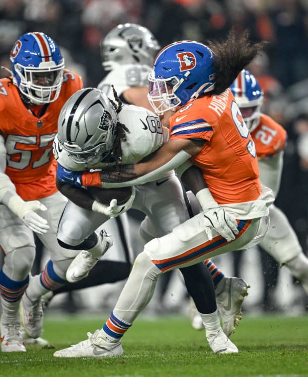 Talanoa Hufanga (9) of the Denver Broncos tackles Ashton Jeanty (2) of the Las Vegas Raiders for a loss during the first quarter at Empower Field at Mile High Stadium on Thursday, Nov. 6, 2025. (Photo by AAron Ontiveroz/The Denver Post)