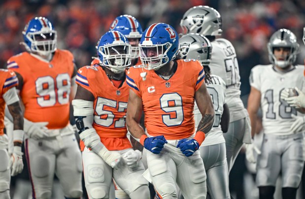 Talanoa Hufanga (9) of the Denver Broncos celebrates sacking Ashton Jeanty (2) of the Las Vegas Raiders during the first quarter at Empower Field at Mile High Stadium on Thursday, Nov. 6, 2025. (Photo by AAron Ontiveroz/The Denver Post)