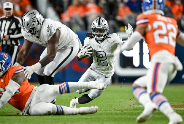 Ashton Jeanty (2) of the Las Vegas Raiders looks for...