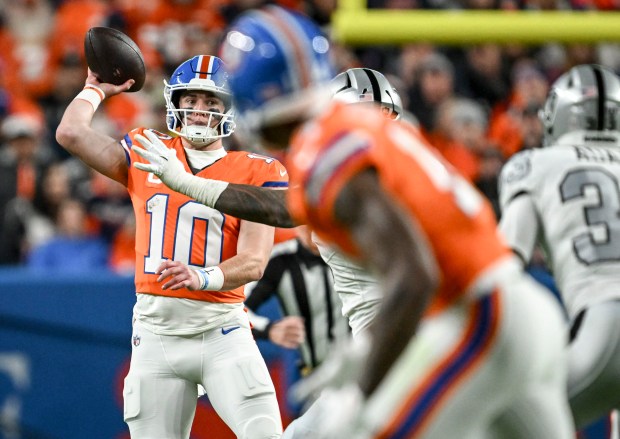 Bo Nix (10) of the Denver Broncos passes against the...