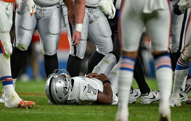 Geno Smith (7) of the Las Vegas Raiders takes his...