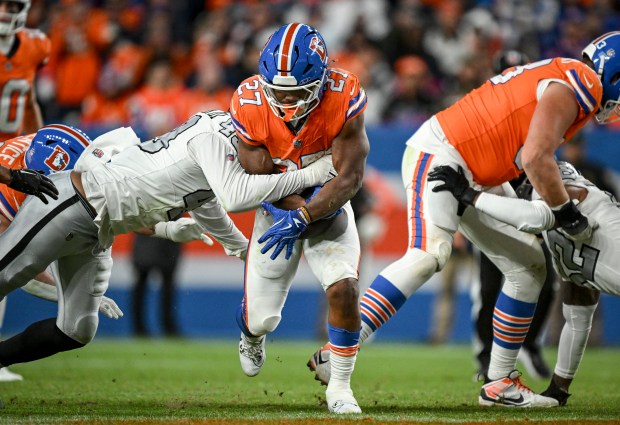 J.K. Dobbins (27) of the Denver Broncos eats clock during the fourth quarter of the Broncos' 10-7 win over the Las Vegas Raiders at Empower Field at Mile High Stadium on Thursday, Nov. 6, 2025. (Photo by AAron Ontiveroz/The Denver Post)