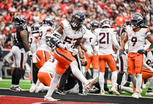 Dre Greenlaw (57) of the Denver Broncos celebrates a goal-line stop against the Houston Texans during the first quarter at NRG Stadium in Houston, Texas on Sunday, Nov. 2, 2025. (Photo by AAron Ontiveroz/The Denver Post)