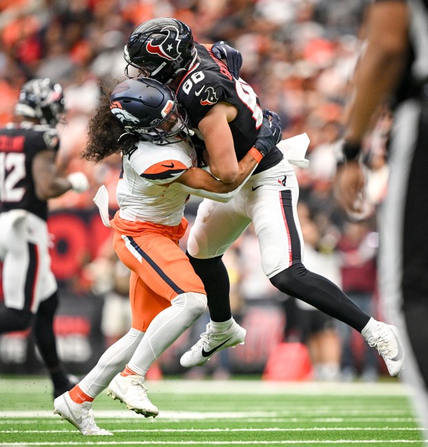 Talanoa Hufanga (9) of the Denver Broncos blows up Harrison Bryant (88) of the Houston Texans during the second quarter at NRG Stadium in Houston, Texas on Sunday, Nov. 2, 2025. (Photo by AAron Ontiveroz/The Denver Post)