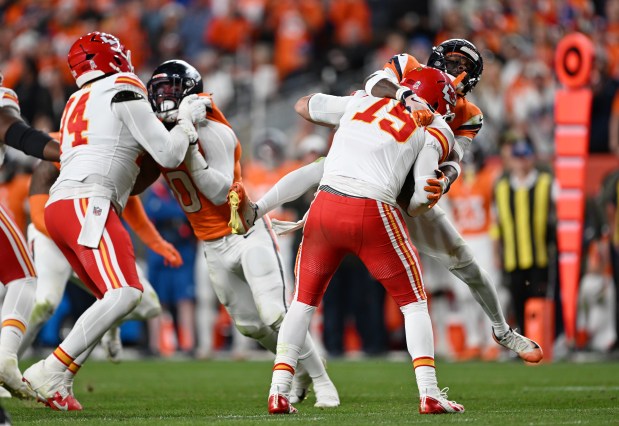 Ja'Quan McMillian (29) of the Denver Broncos comes over the top to sack Patrick Mahomes (15) of the Kansas City Chiefs late in the game at Empower Field at Mile High on Nov. 16, 2025. (Photo by RJ Sangosti/The Denver Post)