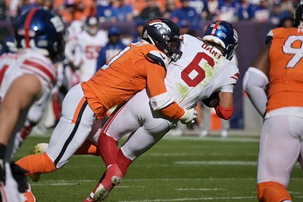 Denver Broncos Jonathon Cooper sacks New York Giants QB Jaxson Dart (6) at Empower Field at Mile High in Denver on Sunday, Oct. 19, 2025. Broncos won 33-32. (Photo by Hyoung Chang/The Denver Post)