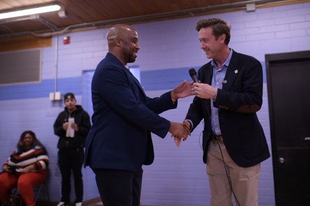 Denver Broncos president Damani Leech, left, and Denver Mayor Mike Johnston attend a community meeting about the Burnham Yard Small Area Plan at La Alma Recreation Center in Denver on Wednesday, Nov. 19, 2025. (Photo by Hyoung Chang/The Denver Post)