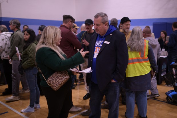 Jessica Proctor, left, asks questions to Denver Broncos general counsel Tim Aragon during a community meeting about the Burnham Yard Small Area Plan at La Alma Recreation Center in Denver on Wednesday, Nov. 19, 2025. (Photo by Hyoung Chang/The Denver Post)