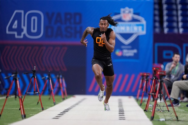 Illinois wide receiver Pat Bryant runs the 40-yard dash at the NFL football scouting combine in Indianapolis, Saturday, March 1, 2025. (AP Photo/George Walker IV)