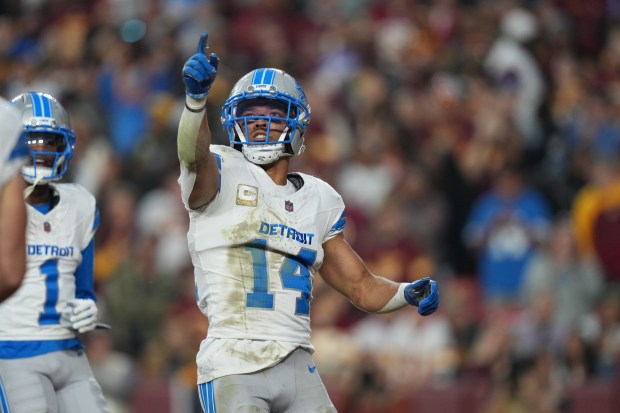 Detroit Lions wide receiver Amon-Ra St. Brown celebrates after scoring...
