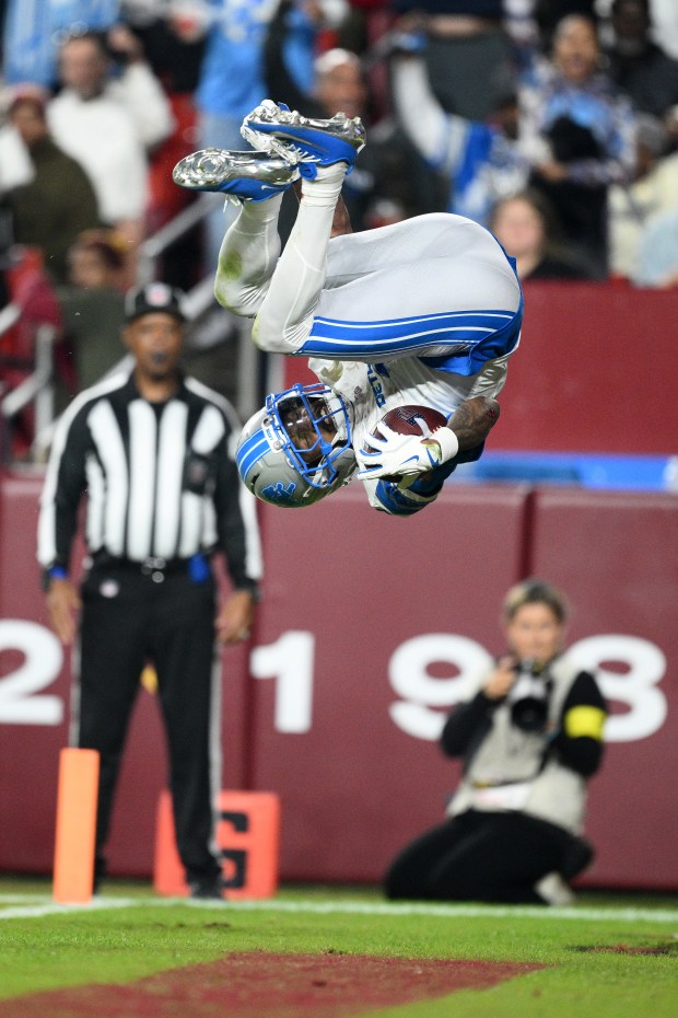 Detroit Lions wide receiver Jameson Williams (1) scores during the...
