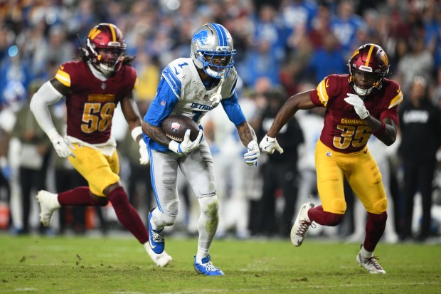 Detroit Lions wide receiver Jameson Williams (1) runs with the...