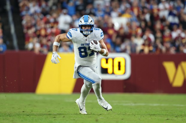Detroit Lions tight end Sam LaPorta (87) runs with the...