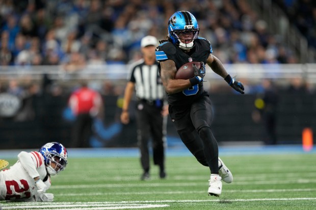 Detroit Lions running back Jahmyr Gibbs (0) runs past New...