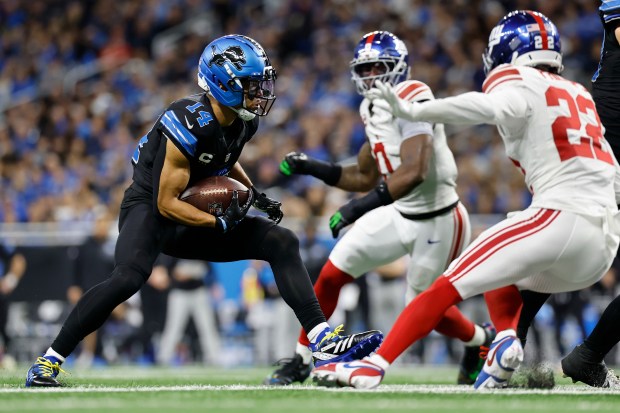 Detroit Lions wide receiver Amon-Ra St. Brown (14) runs against...