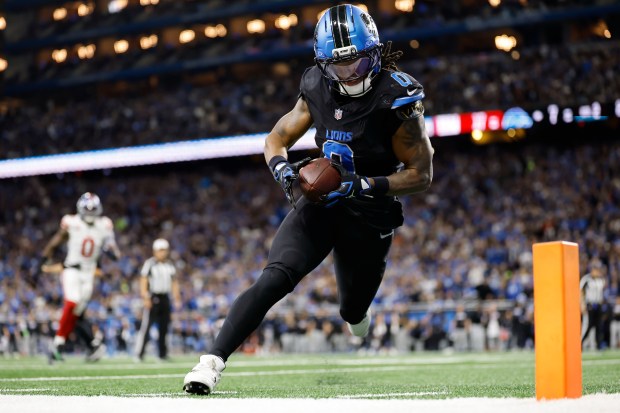 Detroit Lions running back Jahmyr Gibbs (0) catches a touchdown...