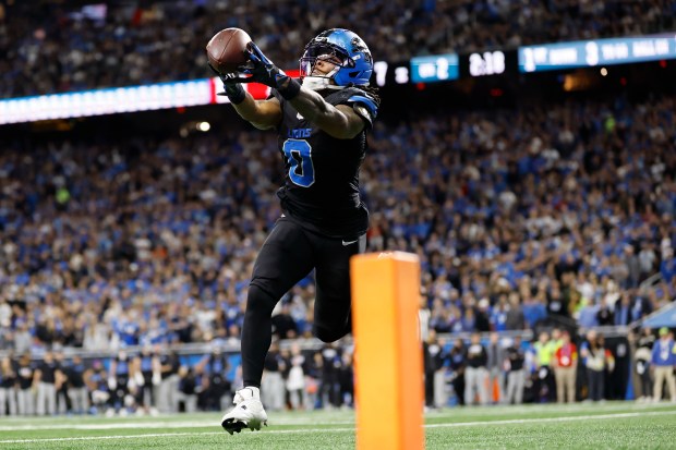 Detroit Lions running back Jahmyr Gibbs (0) catches a touchdown...
