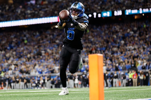 Detroit Lions running back Jahmyr Gibbs (0) catches a touchdown...