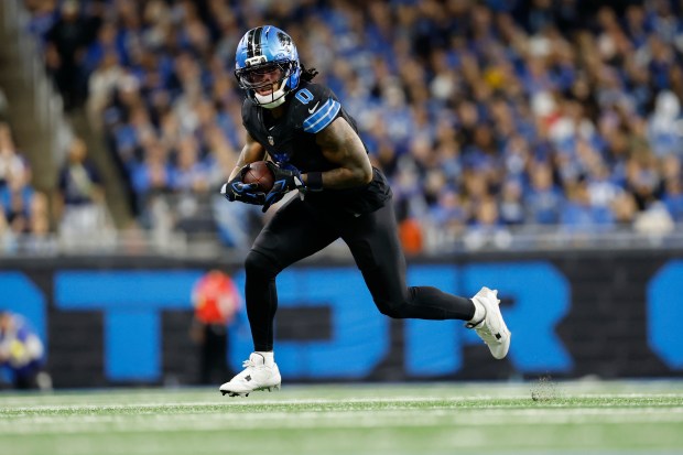 Detroit Lions running back Jahmyr Gibbs (0) runs against the...