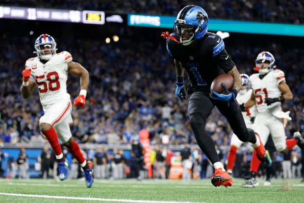 Detroit Lions wide receiver Jameson Williams (1) runs against the...