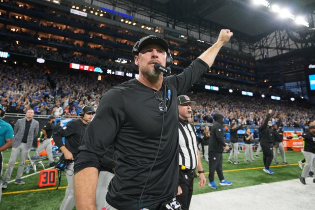 Detroit Lions head coach Dan Campbell celebrates after the team's...
